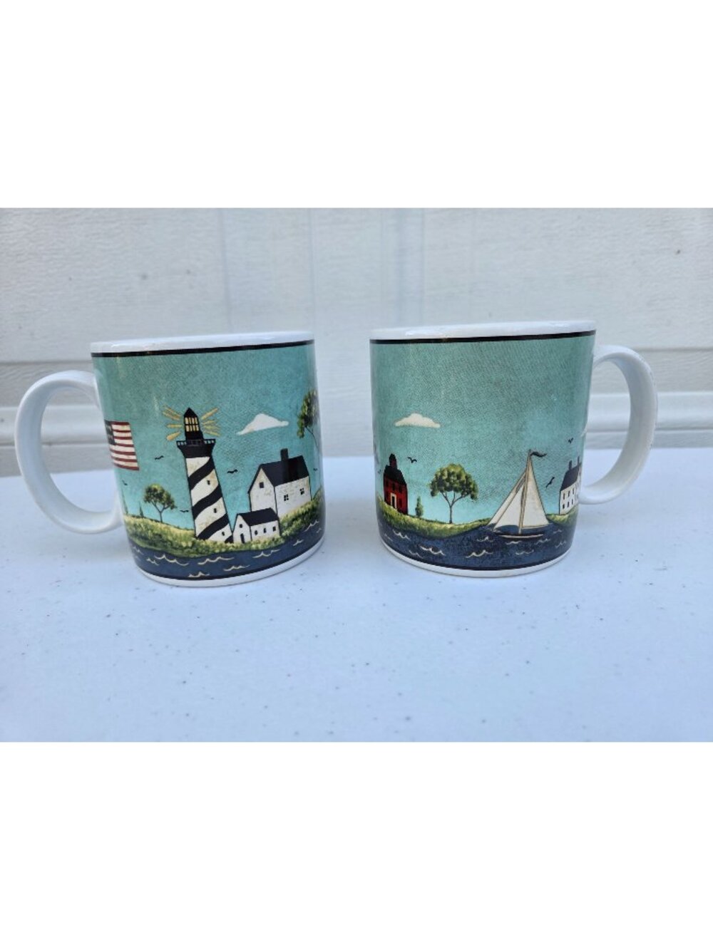 Warren Kimble Coastal Breeze Mug Pair 1998 Sakura NY Lighthouse Sailboat Scene
